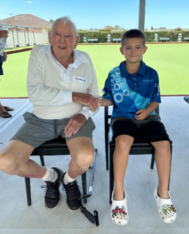 Featured image for “Our club’s oldest and youngest bowlers are featured in this photo: Life Member Wal Browning, aged 96, and Dayton Allan, aged 8, watching the semi-finals of the major singles. #wp #gothestow”